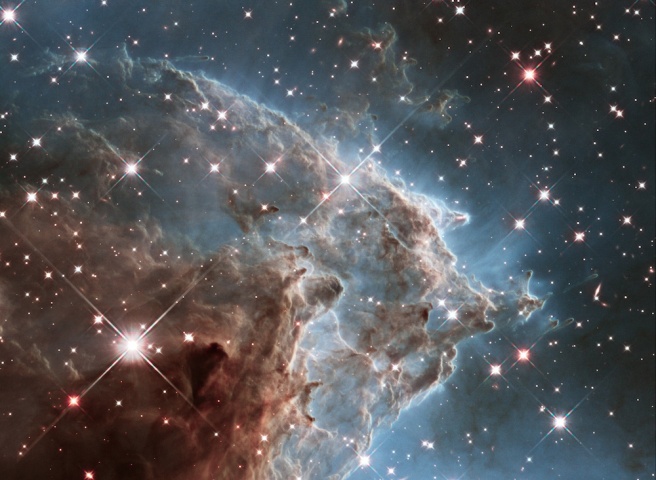 To celebrate its 24th year in orbit, the NASA/ESA Hubble Space Telescope has released this beautiful new image of part of NGC 2174, also known as the Monkey Head Nebula. NGC 2174 lies about 6400 light-years away in the constellation of Orion (The Hunter). Hubble previously viewed this part of the sky back in 2011 — the colourful region is filled with young stars embedded within bright wisps of cosmic gas and dust. This portion of the Monkey Head Nebula was imaged in the infrared using Hubble's Wide Field Camera 3.